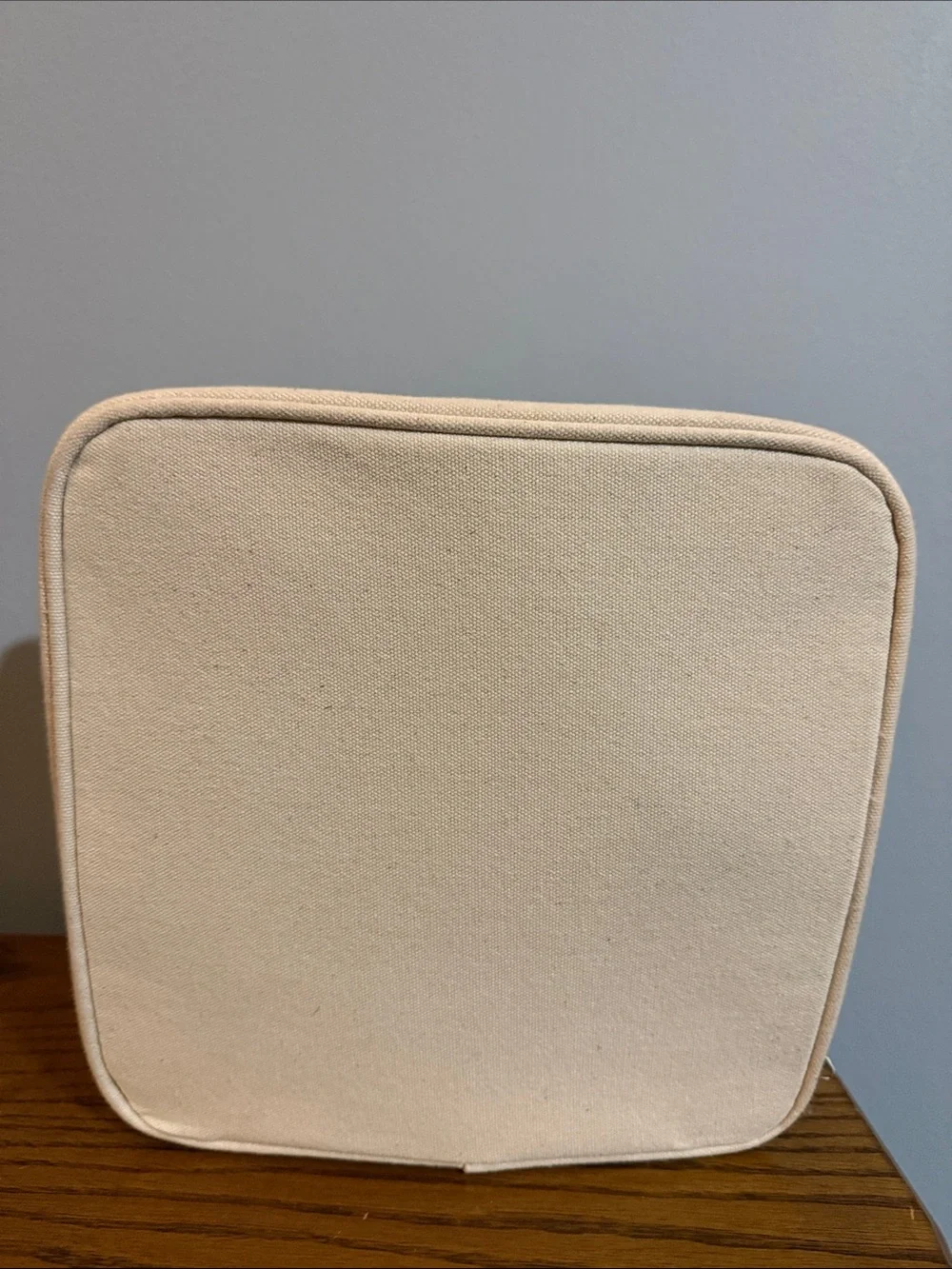 Chloe + Isabel Cream Canvas Cosmetic Pouch with Yellow & Navy Bird Logo